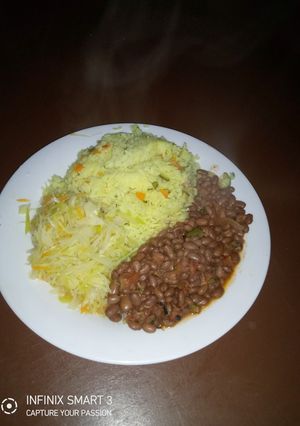 A picture of Tumeric rice, beans and steamed cabbage.