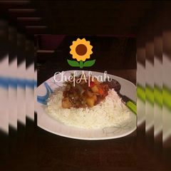 A picture of White rice and potatoes sauce.