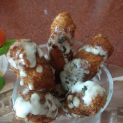 A picture of Potato cutlets with yogurt dip.