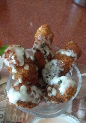 A picture of Potato cutlets with yogurt dip.