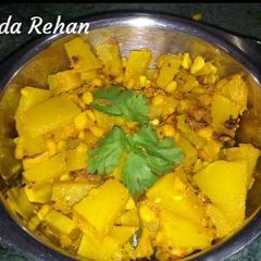 A picture of Pumpkin sabji with chana dal and raw mango.