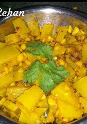 A picture of Pumpkin sabji with chana dal and raw mango.