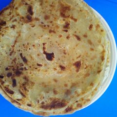 A picture of Soft chapati and green peas.