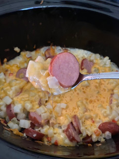 A picture of Slow Cooker Cheesy Kielbasa Hashbrown Casserole.