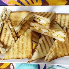 A picture of Grilled sandwich with egg and cheese.