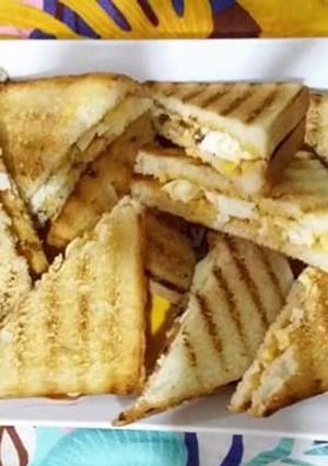 A picture of Grilled sandwich with egg and cheese.