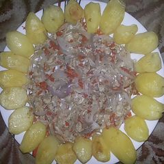 A picture of Potatoes and egg sauce.
