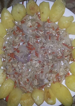 A picture of Potatoes and egg sauce.