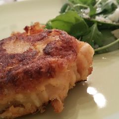 A picture of Salmon fish cakes with roasted sweet potato and lime.