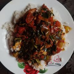 A picture of Boiled rice with vegetable stew.