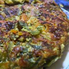 Una foto de Tortilla individual de zapallitos y zanahoria