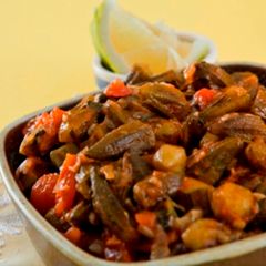 A picture of Baby okra in tomato sauce - bamieh bi zeit.