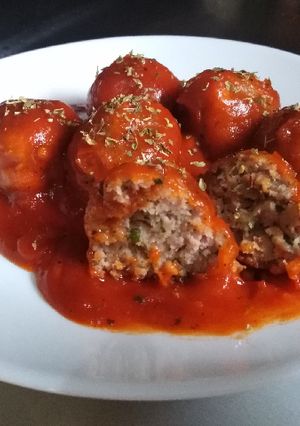A picture of Grandma's Meatballs - with Tomato Oregano Sauce.
