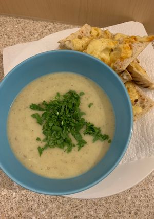 A picture of Celariac & Apple soup finished with Rocket...Cheesy Paprika Ciabatta.