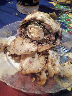 Una foto de Pan de carne relleno. Con papas al horno