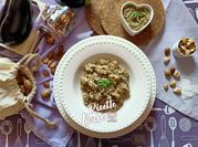 Una foto di gnocchi al pesto