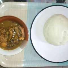 A picture of White soup and pounded yam.