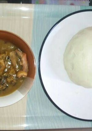 A picture of White soup and pounded yam.