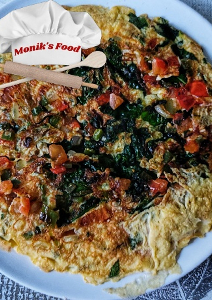 Una foto de Tortilla de jamón, espinacas y vegetales