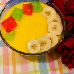 A picture of Fruits custard🍌🍎🍇.