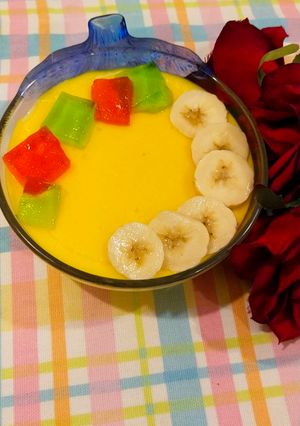 A picture of Fruits custard🍌🍎🍇.