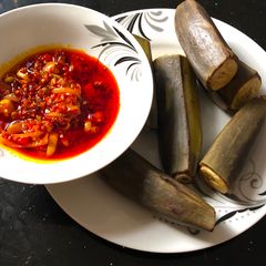 A picture of Palm oil sauce with plantain.