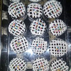 A picture of Chocolate cupcakes with whipped cream frosting.