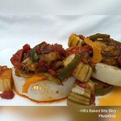 A picture of Garden egg sauce with fish.
