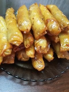 صورة لوصفة زنود الست بعجينه بيتيه رووعه بحشوه اللوز وجوز الهند 👌😋😋