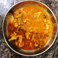 A picture of Vegetable gravy with coconut.