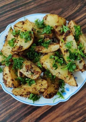 A picture of Garlic Potatoes Wedges.