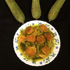 A picture of Dal Fritters in Ridge Gourd curry.