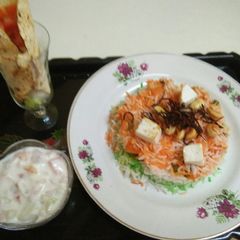 A picture of Tri colour veg pulav with veg raita and masala papad.