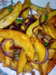 A picture of Easy Sauteéd marinated potato wedges.