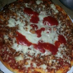 A picture of Loaded Chicken tikka pizza.