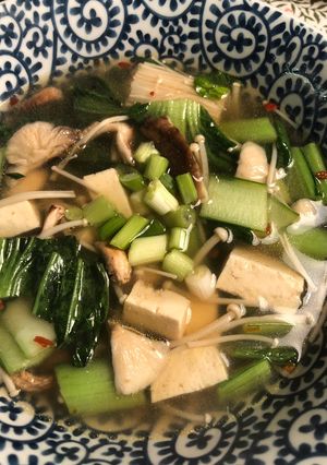 A picture of Noodle soup with mushrooms and greens - vegan.