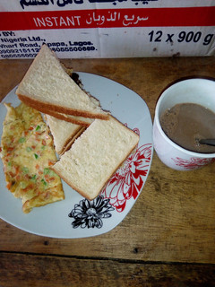 A picture of Fried Eggs,bread and Choco.