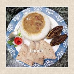 A picture of Mix Dal with Rajma boiled rice bharwa Karela chapati and salad.