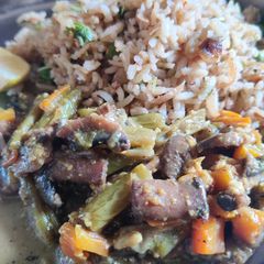 A picture of Green peas pulao and mushroom carrot beans curry.