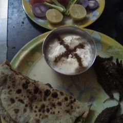 A picture of Stuff karela with meethi ki stuff roti and pudina curd (from skimmed milk).