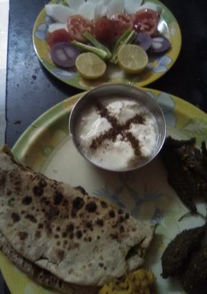A picture of Stuff karela with meethi ki stuff roti and pudina curd (from skimmed milk).