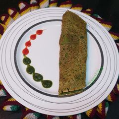A picture of Oats Pesarattu/ Oats spinach Green Moong Dal Dosa /.