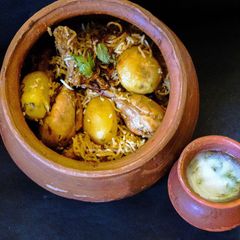 A picture of Kolkata style Chicken Biryani & Burhani.