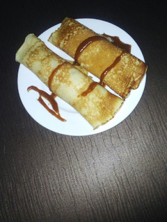 A picture of Crêpe with homemade caramel syrup.