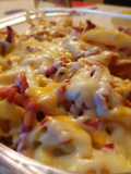 Patatas fritas con bacon y quesos