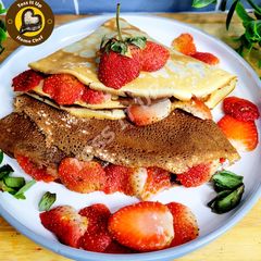 A picture of French Crepes In 2 Different Flavours Chocolate And Vanilla With One Batter.