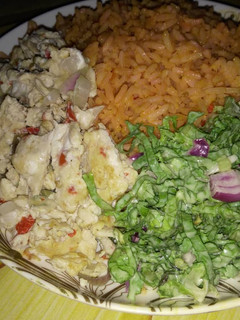 A picture of Jollop rice and salad with scramble egg.