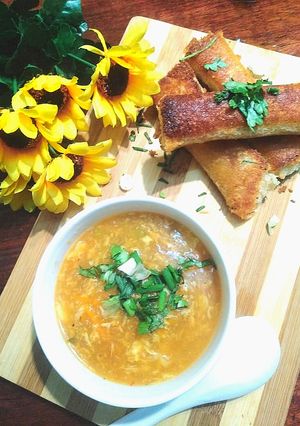 A picture of Hot and Sour Soup with Crispy Cheese Bread Rolls.