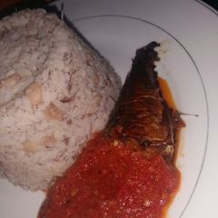 A picture of Rice and Beans with fish stew.