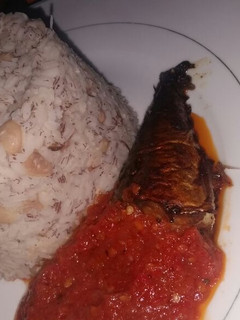 A picture of Rice and Beans with fish stew.
